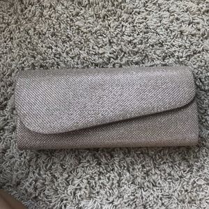 Rose gold clutch with, chain handle attached